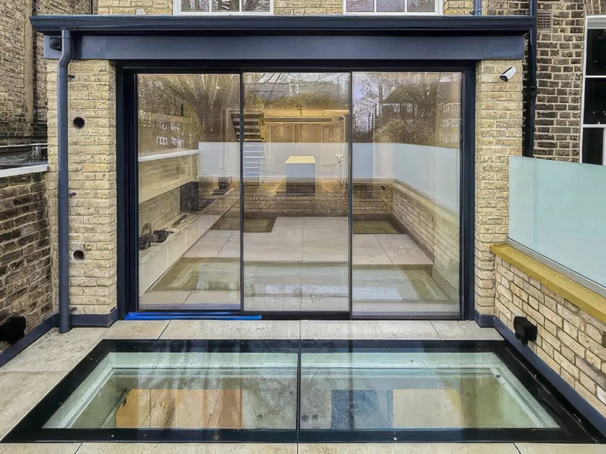 Slim sliding doors over a walk-on glass floor